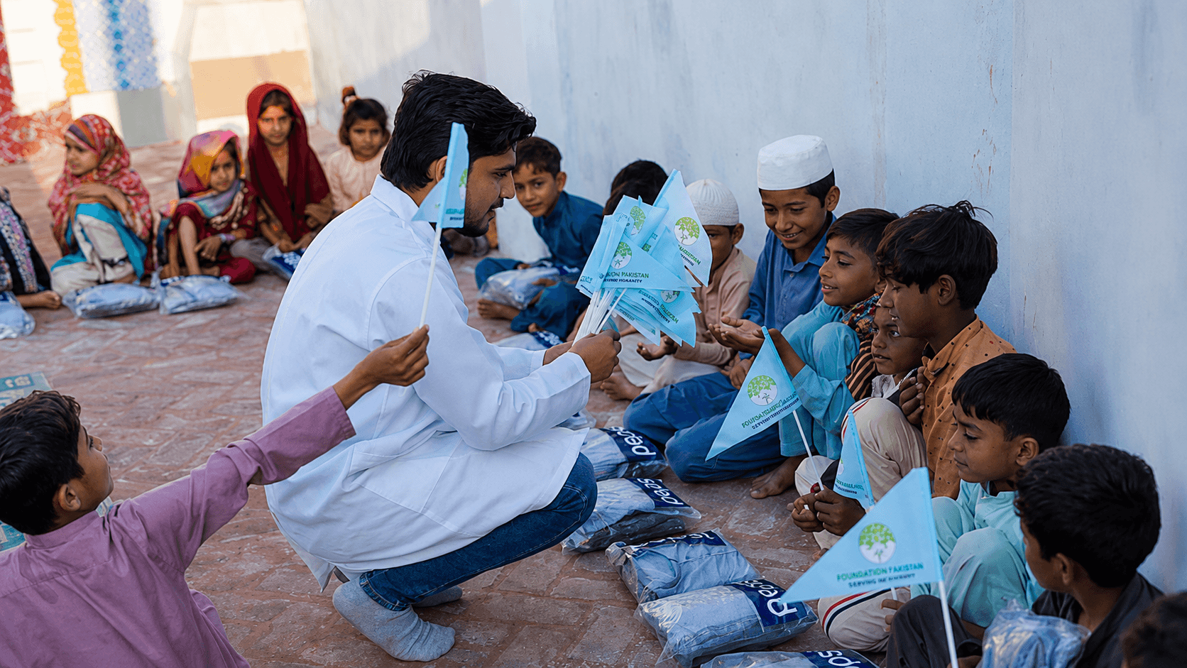 Children receiving school kits
